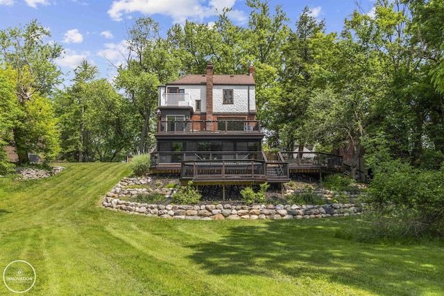 35727 Elm St, Wayne, MI 48184 - rear view of property with a balcony, a deck, a chimney, and a lawn