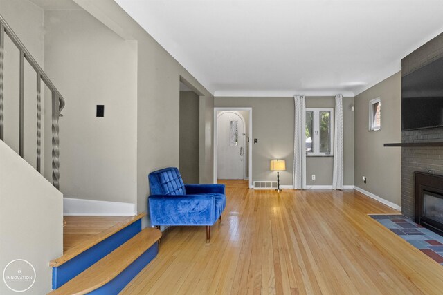 35727 Elm St, Wayne, MI 48184 - sitting room with stairs, hardwood / wood-style flooring, and a fireplace