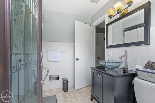 35727 Elm St, Wayne, MI 48184 - full bath with tile walls, vanity, a shower with curtain, tile patterned floors, and wainscoting