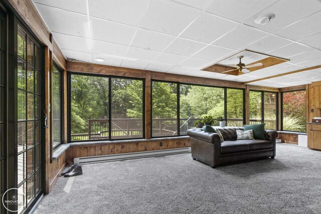 35727 Elm St, Wayne, MI 48184 - sunroom / solarium featuring carpet, a baseboard radiator, healthy amount of natural light, wood walls, and a paneled ceiling