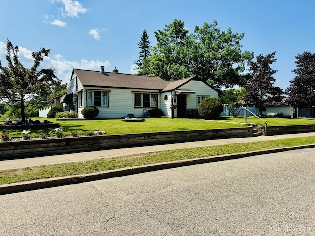 292 Chestnut St, Kingsford, MI 49802 - single story home featuring a front lawn and a chimney
