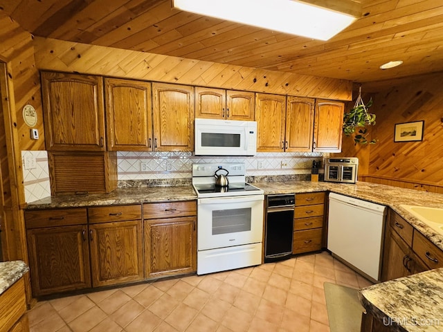 292 Chestnut St, Kingsford, MI 49802 - kitchen with white appliances, backsplash, wood ceiling, brown cabinetry, and wood walls