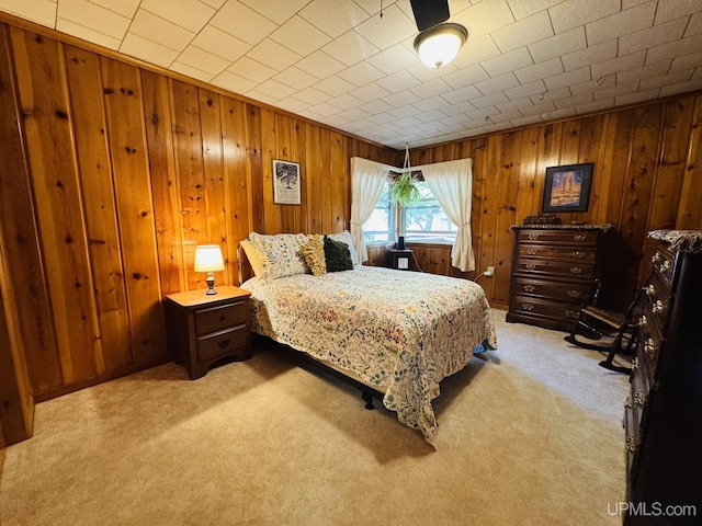 292 Chestnut St, Kingsford, MI 49802 - bedroom featuring light carpet and wooden walls