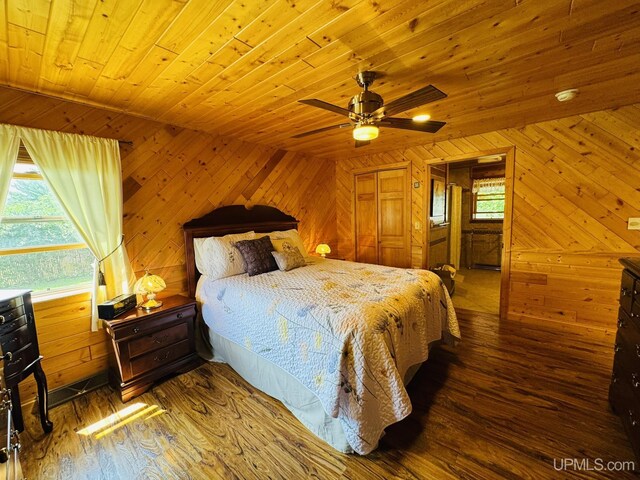 292 Chestnut St, Kingsford, MI 49802 - bedroom featuring hardwood / wood-style floors, wooden ceiling, wood walls, and ceiling fan