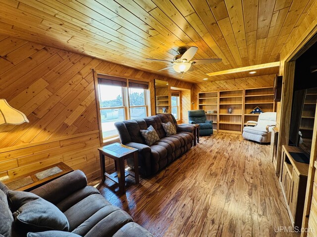 292 Chestnut St, Kingsford, MI 49802 - living room with wood ceiling, wooden walls, built in features, ceiling fan, and hardwood / wood-style flooring