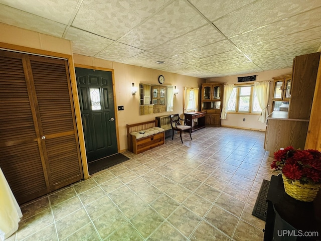 292 Chestnut St, Kingsford, MI 49802 - entrance foyer with tile patterned flooring and a paneled ceiling