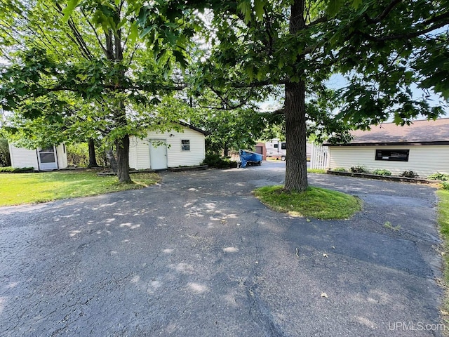 292 Chestnut St, Kingsford, MI 49802 - view of front facade with driveway and a front yard