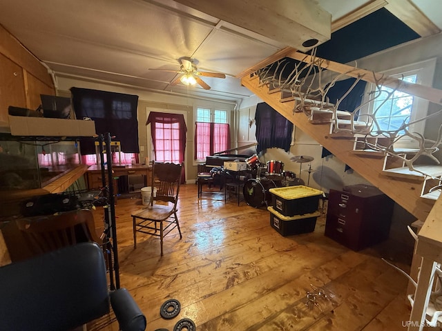 E2903 H44 Rd, Traunik, MI 49891 - living area with stairs, hardwood / wood-style floors, and a ceiling fan