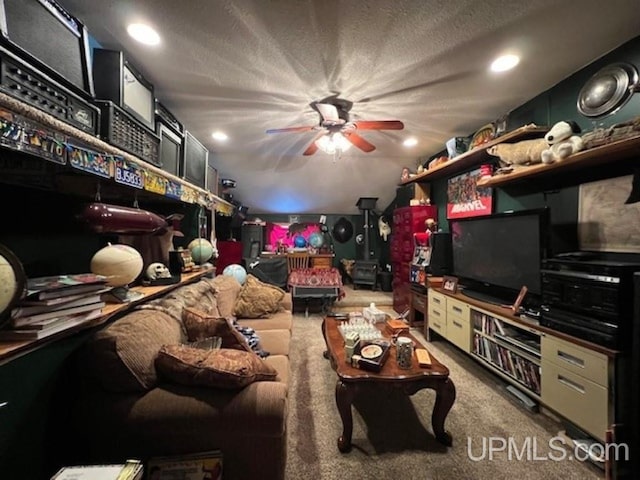E2903 H44 Rd, Traunik, MI 49891 - living area featuring ceiling fan, recessed lighting, carpet flooring, and a textured ceiling
