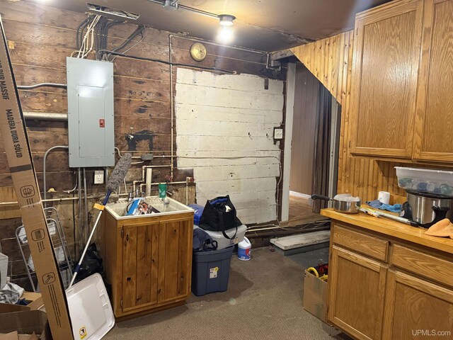 E2903 H44 Rd, Traunik, MI 49891 - unfinished basement with electric panel, wood walls, and carpet floors