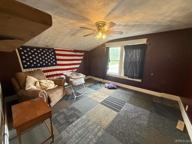 E2903 H44 Rd, Traunik, MI 49891 - additional living space featuring lofted ceiling, a textured ceiling, and ceiling fan
