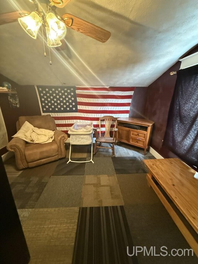 E2903 H44 Rd, Traunik, MI 49891 - bedroom featuring lofted ceiling, ceiling fan, and wood finished floors