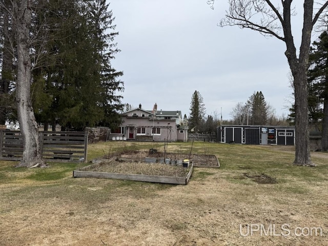 E2903 H44 Rd, Traunik, MI 49891 - view of yard with a vegetable garden and an outdoor structure