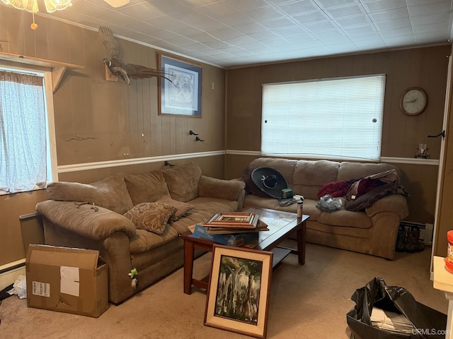 E2903 H44 Rd, Traunik, MI 49891 - carpeted living room with ornamental molding and wood walls