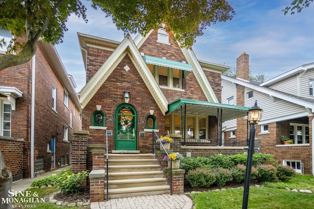 1258-1260 Lakepointe St, Grosse Pointe, MI 48230 - tudor home with brick siding and covered porch
