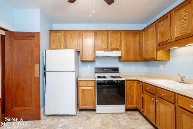 1258-1260 Lakepointe St, Grosse Pointe, MI 48230 - kitchen featuring white appliances, under cabinet range hood, brown cabinetry, and light countertops