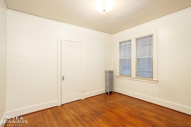 1258-1260 Lakepointe St, Grosse Pointe, MI 48230 - spare room featuring radiator heating unit and wood finished floors