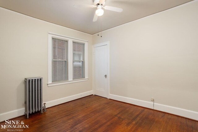 1258-1260 Lakepointe St, Grosse Pointe, MI 48230 - spare room featuring radiator, dark wood-style floors, and a ceiling fan