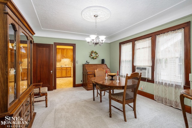 1258-1260 Lakepointe St, Grosse Pointe, MI 48230 - dining space with a chandelier, light colored carpet, cooling unit, and a textured ceiling