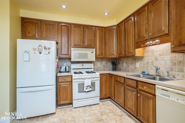 1258-1260 Lakepointe St, Grosse Pointe, MI 48230 - kitchen featuring white appliances, brown cabinetry, tasteful backsplash, light countertops, and recessed lighting
