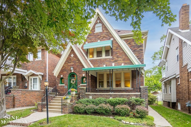 1258-1260 Lakepointe St, Grosse Pointe, MI 48230 - view of front of house featuring brick siding and covered porch
