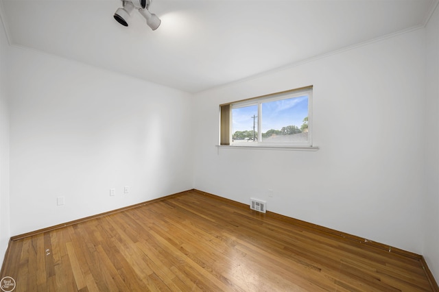 28368 Besmore Dr, Warren, MI 48093 - unfurnished room with wood finished floors, ornamental molding, and ceiling fan