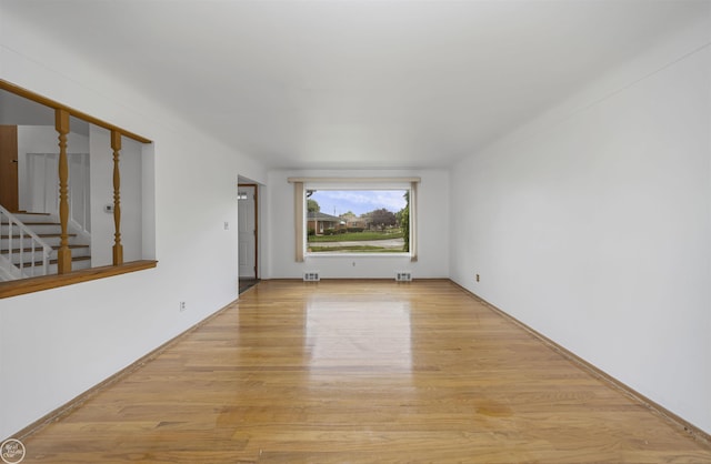 28368 Besmore Dr, Warren, MI 48093 - unfurnished room with wood finished floors and stairs