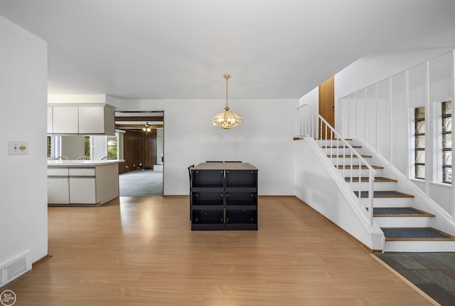 28368 Besmore Dr, Warren, MI 48093 - stairway featuring wood finished floors and a ceiling fan