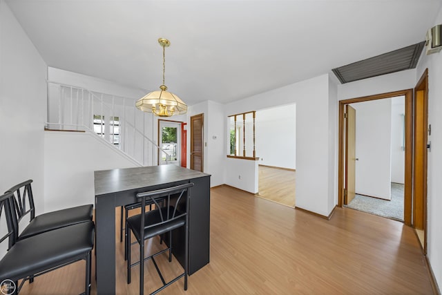 28368 Besmore Dr, Warren, MI 48093 - dining area with light wood finished floors and a chandelier