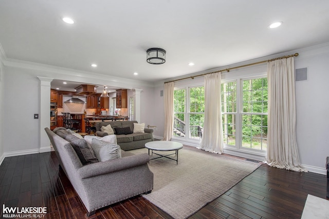 25986 Glenmoor St, Novi, MI 48374 - living room featuring ornate columns, dark wood finished floors, ornamental molding, and recessed lighting