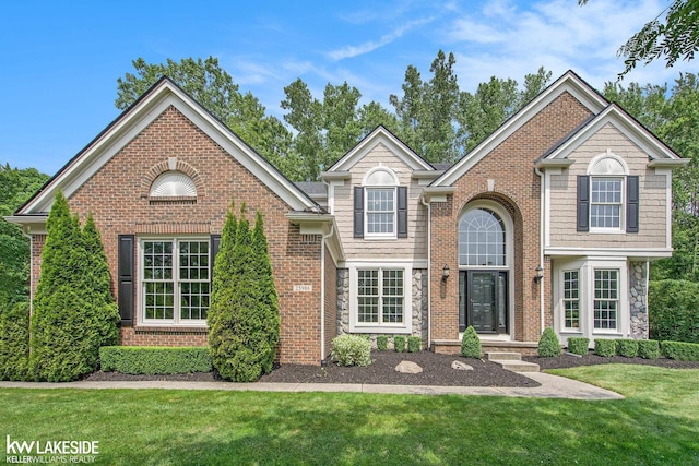 25986 Glenmoor St, Novi, MI 48374 - traditional home with a front lawn and brick siding