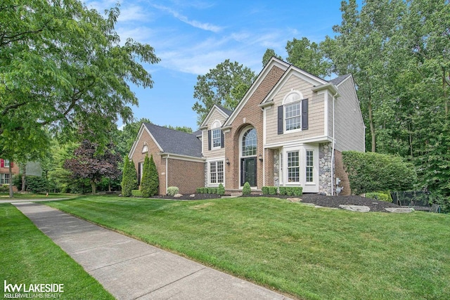 25986 Glenmoor St, Novi, MI 48374 - traditional home featuring a front yard and stone siding