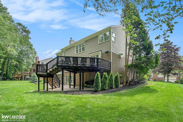 25986 Glenmoor St, Novi, MI 48374 - back of property featuring a wooden deck, stairway, brick siding, a yard, and a patio area