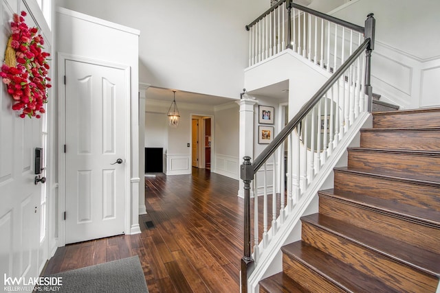 25986 Glenmoor St, Novi, MI 48374 - entrance foyer with a decorative wall, hardwood / wood-style flooring, stairs, wainscoting, and ornamental molding