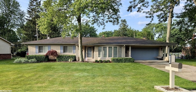 6748 Yarborough Dr, Shelby Twp, MI 48316 - single story home with an attached garage, concrete driveway, brick siding, and a front lawn