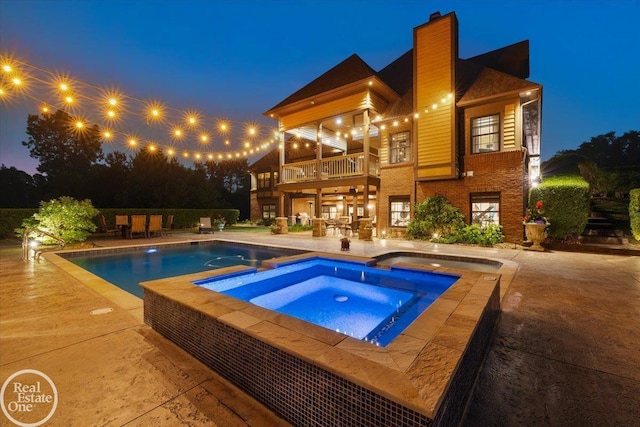 2940 Buell Rd, Oakland Twp, MI 48363 - view of pool with a patio area and a pool with connected hot tub