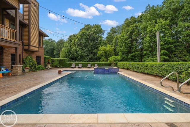 2940 Buell Rd, Oakland Twp, MI 48363 - view of pool featuring a patio area and a pool with connected hot tub
