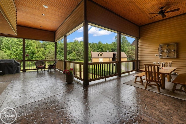 2940 Buell Rd, Oakland Twp, MI 48363 - sunroom with ceiling fan, outdoor dining space, lofted ceiling, and view of wooded area