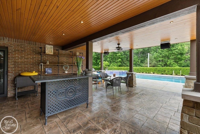 2940 Buell Rd, Oakland Twp, MI 48363 - view of patio featuring an outdoor pool, a ceiling fan, and exterior bar