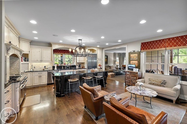 2940 Buell Rd, Oakland Twp, MI 48363 - living area with a chandelier, recessed lighting, and dark wood finished floors