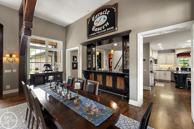 2940 Buell Rd, Oakland Twp, MI 48363 - dining room featuring a towering ceiling and dark wood-style floors