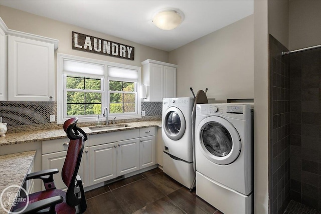 2940 Buell Rd, Oakland Twp, MI 48363 - washroom featuring independent washer and dryer, dark wood-type flooring, and cabinet space