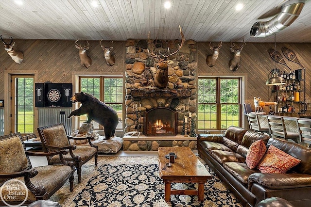 2940 Buell Rd, Oakland Twp, MI 48363 - living room featuring wooden walls, recessed lighting, a fireplace, and wood ceiling