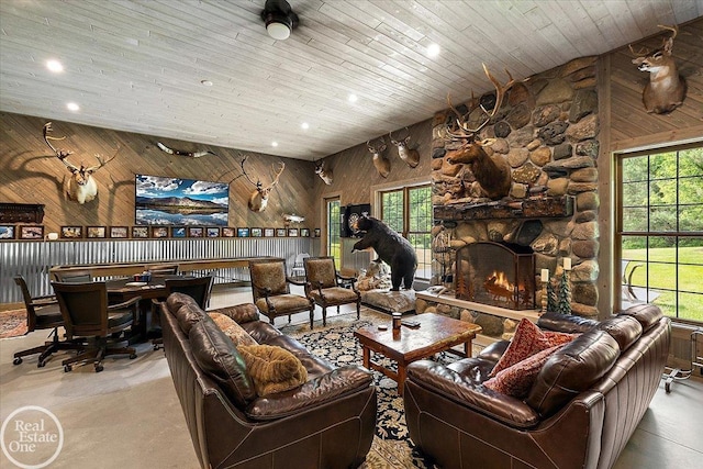 2940 Buell Rd, Oakland Twp, MI 48363 - living room with recessed lighting, a stone fireplace, and wood walls