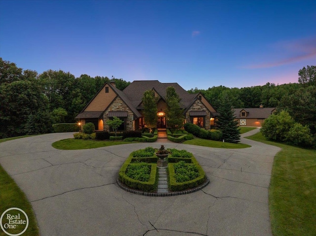 2940 Buell Rd, Oakland Twp, MI 48363 - view of front facade featuring curved driveway and stone siding
