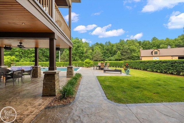 2940 Buell Rd, Oakland Twp, MI 48363 - view of patio with ceiling fan and an outdoor pool