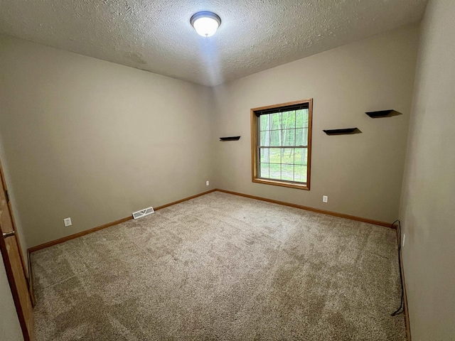 876 N Sanford Ln, Au Gres, MI 48703 - carpeted spare room featuring a textured ceiling and baseboards