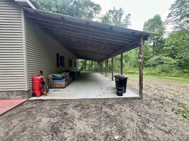 876 N Sanford Ln, Au Gres, MI 48703 - view of vehicle parking featuring an attached carport