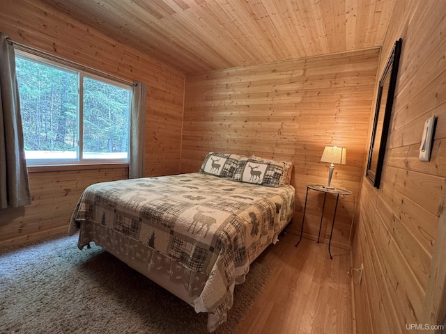 E8310 County Road 440th Hwy, Wetmore, MI 49895 - bedroom with wooden walls and wood ceiling