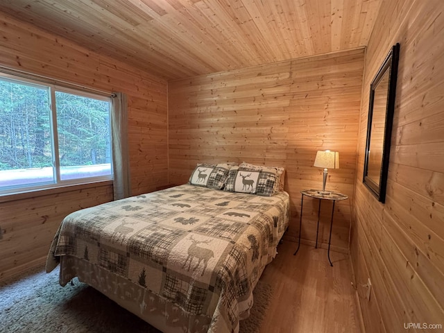 E8310 County Road 440th Hwy, Wetmore, MI 49895 - bedroom with wood walls, wood ceiling, and wood finished floors